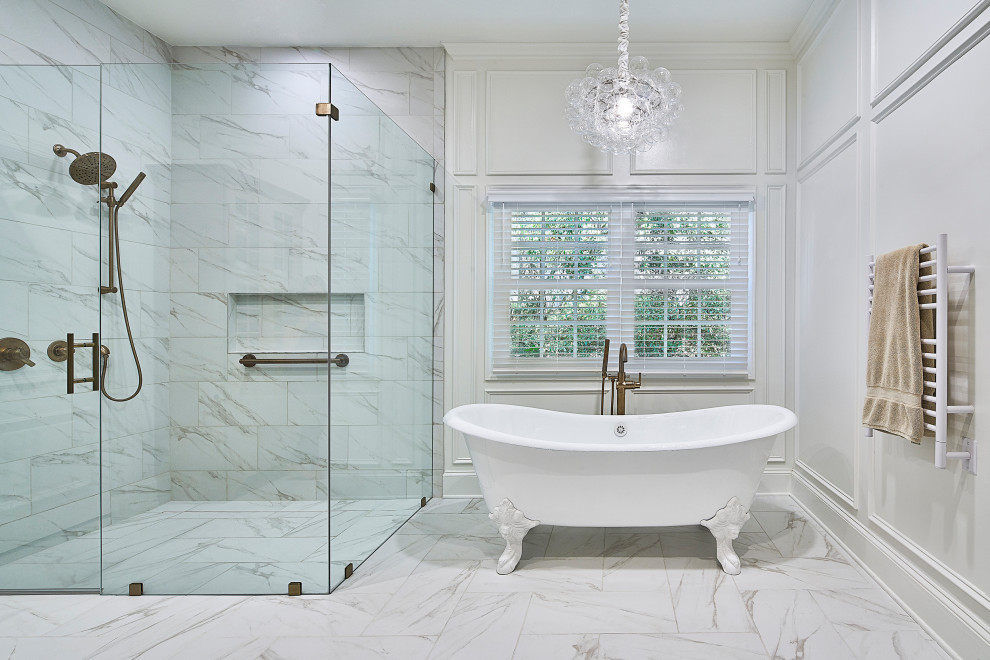 Inspiration for a mid-sized transitional master white tile and porcelain tile porcelain tile and white floor bathroom remodel in Charlotte with flat-panel cabinets, white cabinets, white walls, an undermount sink, quartz countertops, a hinged shower door and white countertops