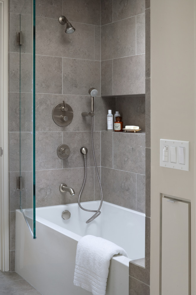 Photo of a medium sized contemporary bathroom in Santa Barbara with a submerged sink, flat-panel cabinets, grey cabinets, an alcove bath, a shower/bath combination, white walls, porcelain flooring and porcelain tiles.