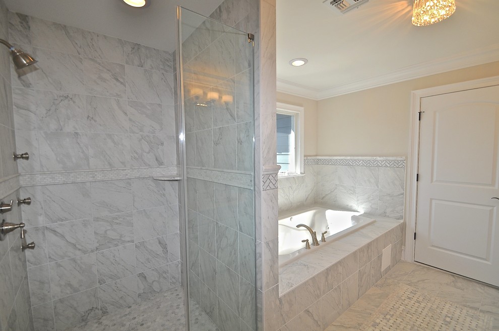 Double shower - mid-sized transitional master gray tile and porcelain tile porcelain tile double shower idea in New York with an undermount sink, raised-panel cabinets, light wood cabinets, quartzite countertops, a hot tub, a one-piece toilet and white walls