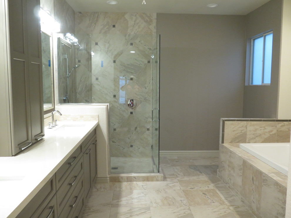 Example of a large trendy master multicolored tile and ceramic tile ceramic tile bathroom design in Phoenix with shaker cabinets, beige cabinets, a two-piece toilet, beige walls, a drop-in sink and quartz countertops