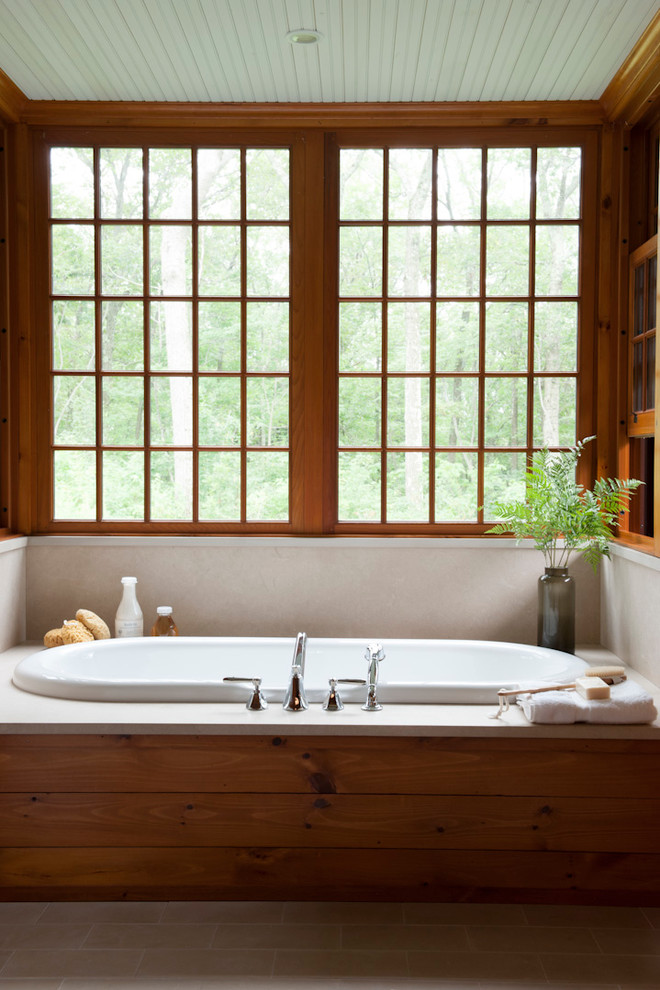 Design ideas for a rustic bathroom in Bridgeport with a built-in bath.