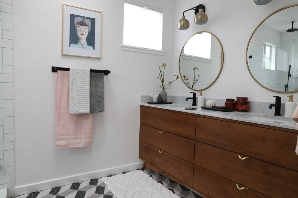 Large mid-century modern master ceramic tile and multicolored floor alcove shower photo in San Francisco with furniture-like cabinets, medium tone wood cabinets, white walls, an undermount sink, marble countertops, a hinged shower door and white countertops