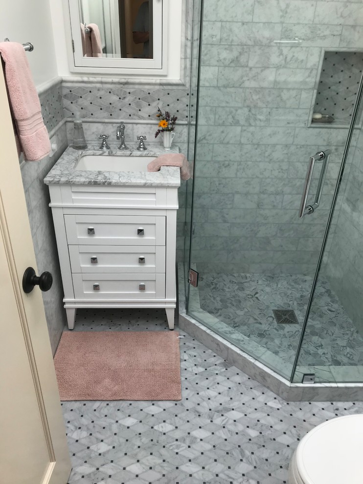 This is an example of a medium sized classic shower room bathroom in San Francisco with freestanding cabinets, white cabinets, a corner shower, white walls, marble flooring, a submerged sink, grey floors and a hinged door.