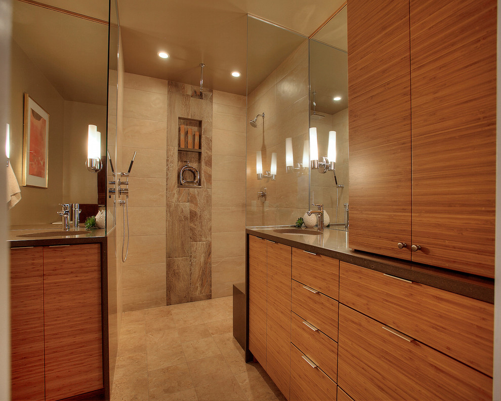 Photo of a medium sized contemporary ensuite bathroom in Seattle with a submerged sink, flat-panel cabinets, medium wood cabinets, engineered stone worktops, a built-in shower, a one-piece toilet, beige tiles, stone tiles, beige walls and ceramic flooring.