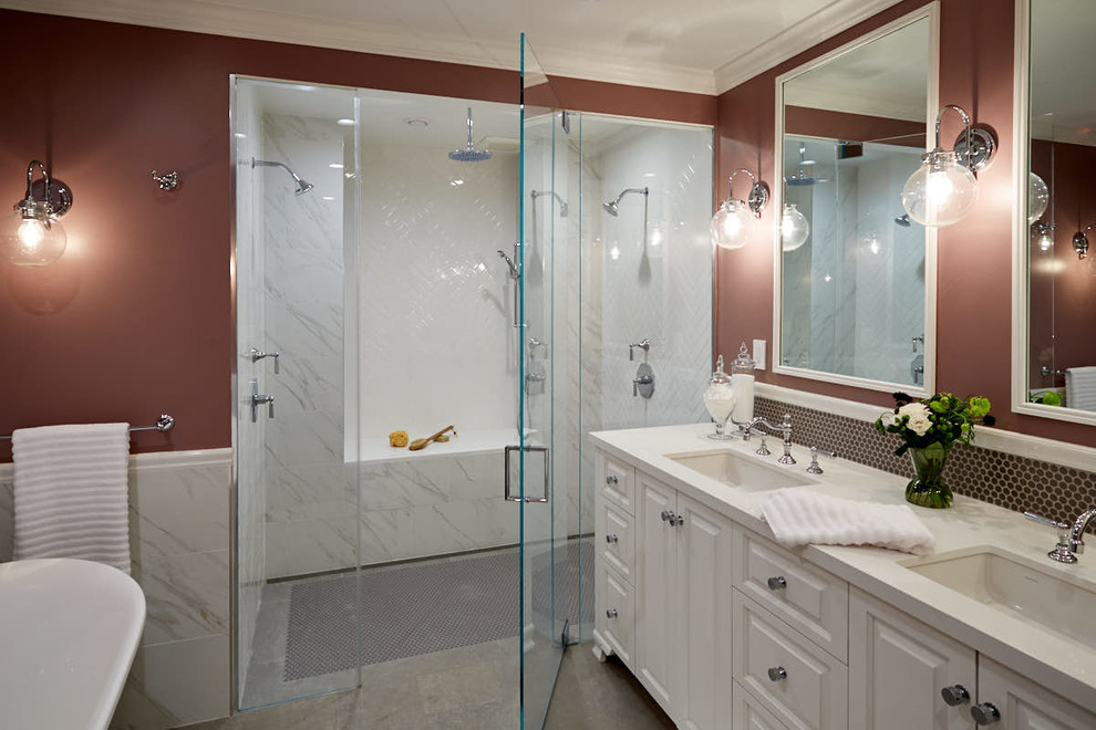 Bathroom - mid-sized transitional master brown tile and mosaic tile porcelain tile and gray floor bathroom idea in San Francisco with raised-panel cabinets, white cabinets, brown walls, an undermount sink, quartz countertops and a hinged shower door