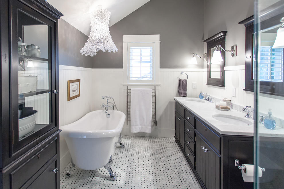 Inspiration for a large traditional grey and black ensuite bathroom in Vancouver with a submerged sink, black cabinets, a claw-foot bath, white tiles, white floors, flat-panel cabinets, a corner shower, grey walls, marble flooring, marble worktops and white worktops.