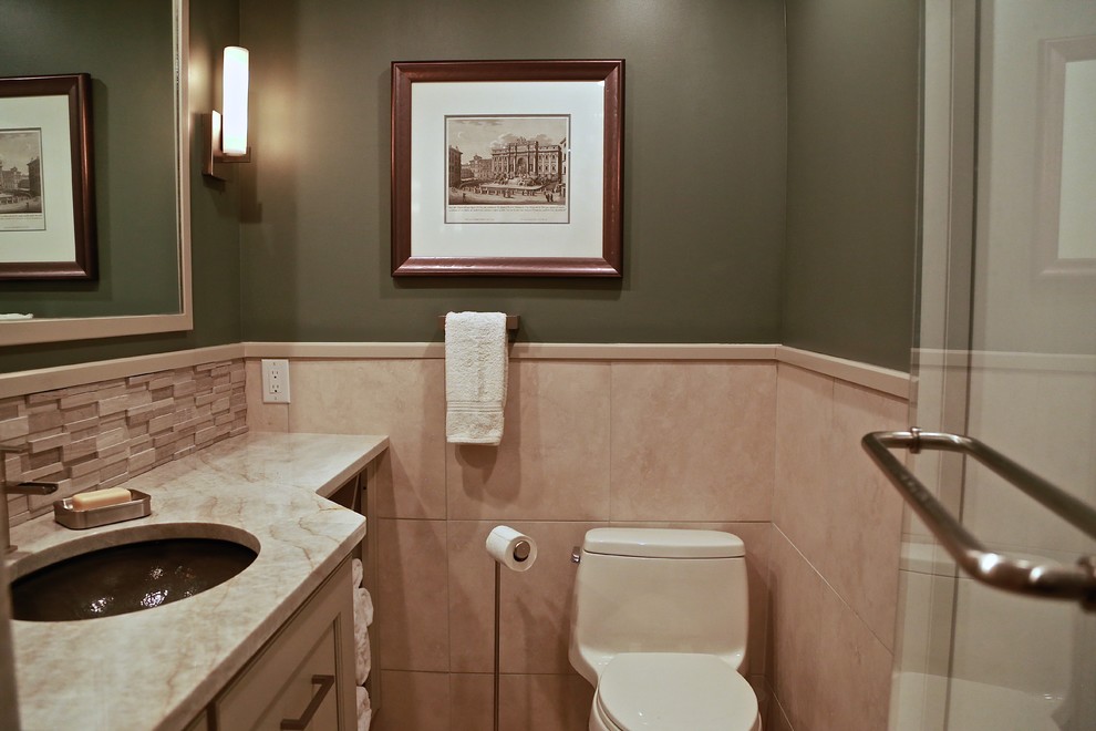 Example of a mid-sized trendy beige tile and glass tile bathroom design in Philadelphia with shaker cabinets, beige cabinets, granite countertops and green walls