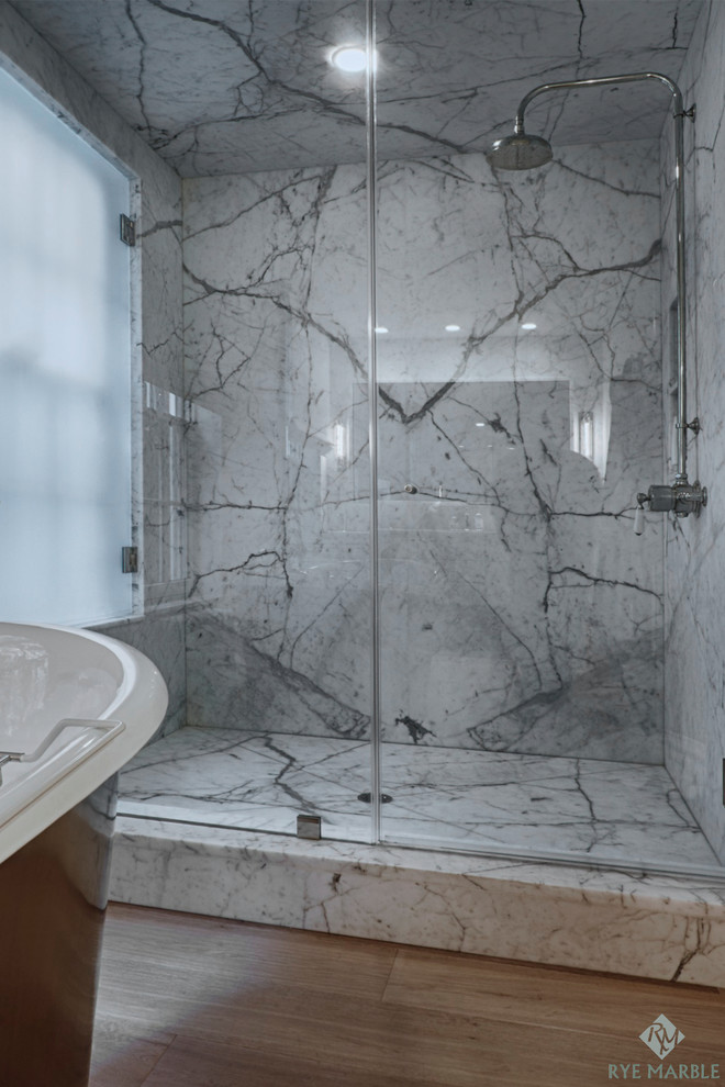 Traditional bathroom in New York with marble worktops, white tiles, stone slabs and marble flooring.