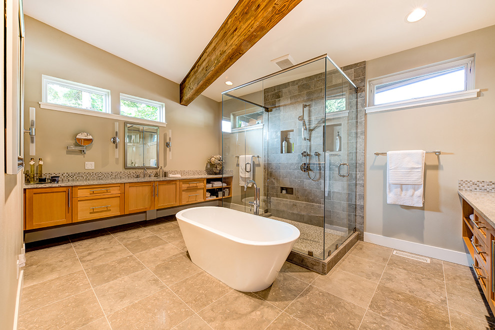 Inspiration for a contemporary ensuite bathroom in Seattle with shaker cabinets, granite worktops, a freestanding bath, a double shower, stone tiles and limestone flooring.
