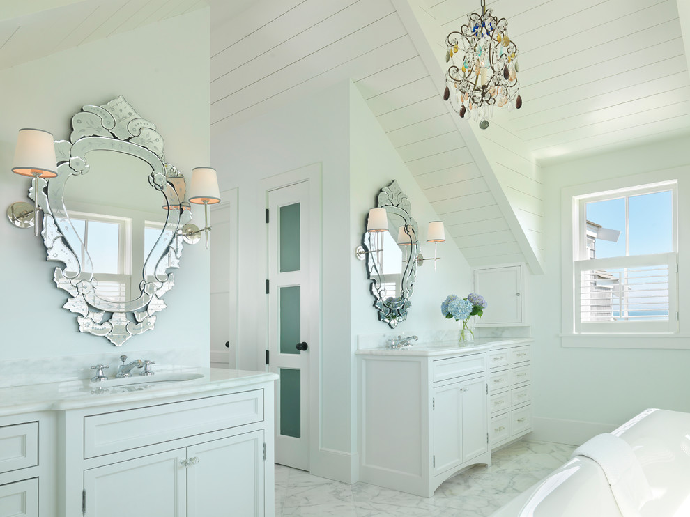 Inspiration for a coastal bathroom remodel in Boston with white cabinets