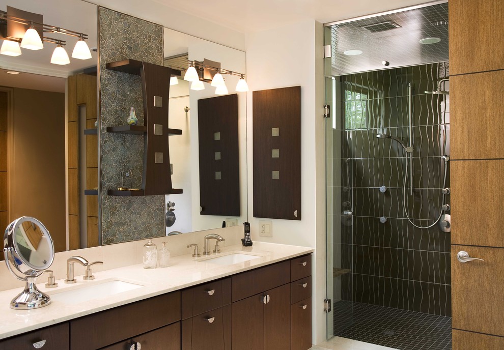 Inspiration for a contemporary bathroom in New York with dark wood cabinets.