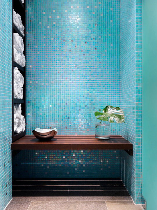 Large trendy 3/4 blue tile and mosaic tile concrete floor bathroom photo in Vancouver with open cabinets, dark wood cabinets, a one-piece toilet, blue walls and a vessel sink