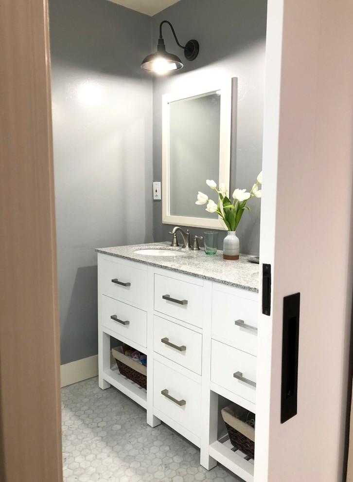 This is an example of a medium sized classic ensuite bathroom in San Francisco with a corner shower, white tiles, ceramic tiles, a submerged sink, grey floors and a hinged door.
