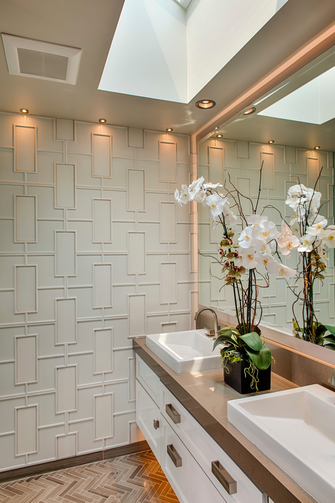 Mid-sized trendy master beige tile and ceramic tile porcelain tile and beige floor walk-in shower photo in Los Angeles with shaker cabinets, white cabinets, white walls, a vessel sink, quartz countertops and a hinged shower door