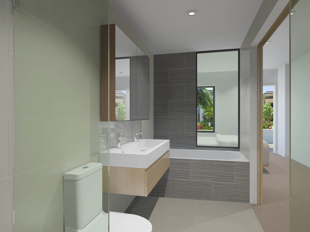 Photo of a small modern ensuite bathroom in Brisbane.