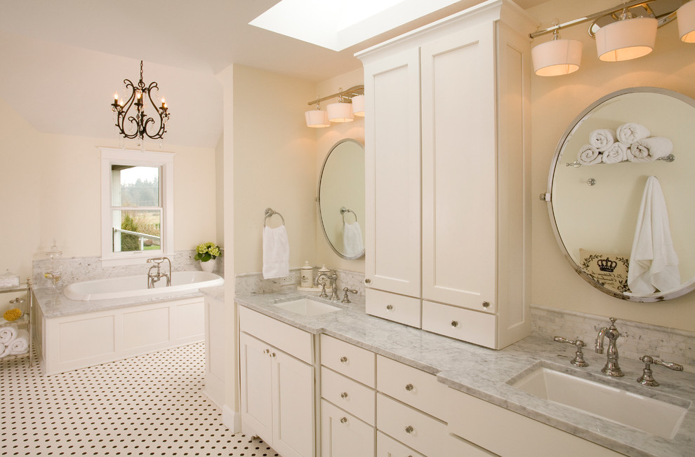 Inspiration for a large timeless multicolored tile and porcelain tile porcelain tile bathroom remodel in Seattle with an undermount sink, shaker cabinets, white cabinets, marble countertops, a two-piece toilet and white walls