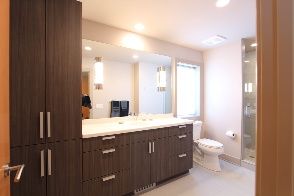 Photo of a large contemporary shower room bathroom in Other with flat-panel cabinets, grey cabinets, an alcove shower, a two-piece toilet, white tiles, porcelain tiles, grey walls, porcelain flooring, a submerged sink and engineered stone worktops.