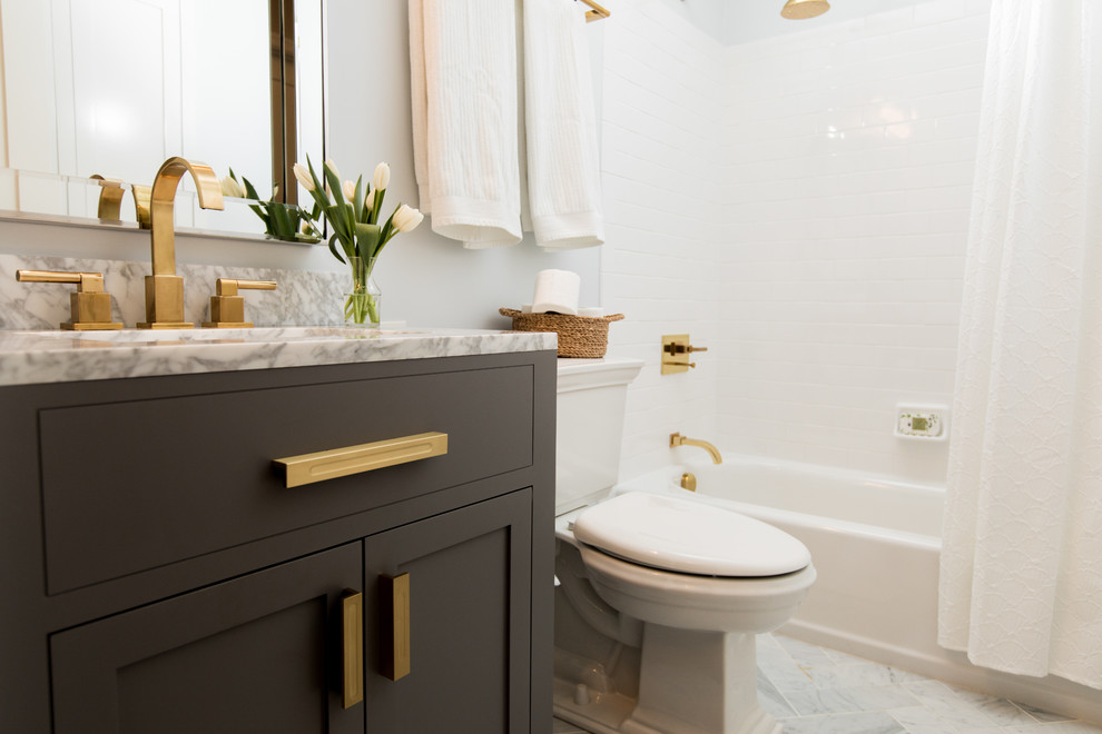 Bathroom - small transitional gray tile and subway tile marble floor and gray floor bathroom idea in Baltimore with shaker cabinets, gray cabinets, a two-piece toilet, gray walls, an undermount sink and marble countertops
