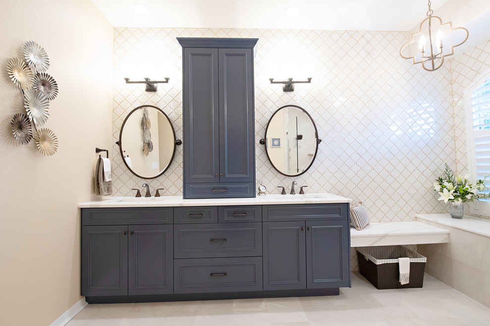 Mid-sized transitional master beige tile and porcelain tile porcelain tile and beige floor bathroom photo in Tampa with flat-panel cabinets, blue cabinets, a one-piece toilet, yellow walls, an undermount sink, quartz countertops and white countertops