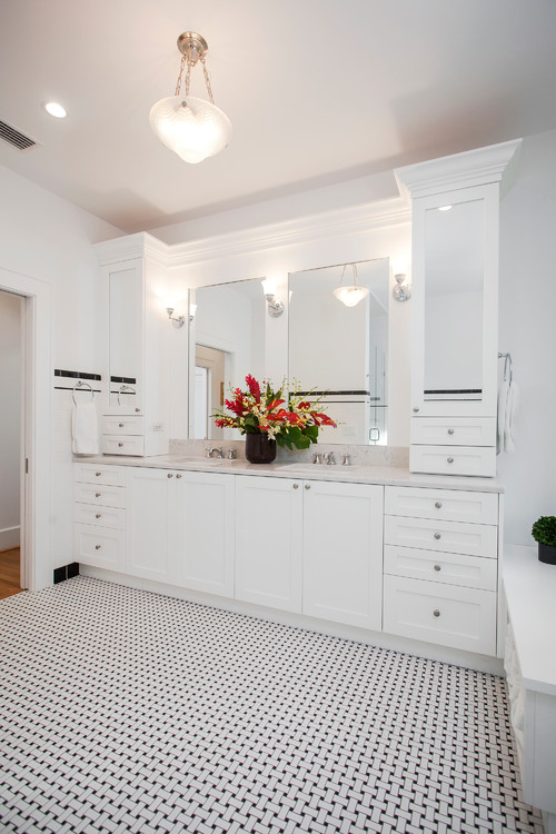 Classic white bathroom vanity with ample storage drawers and double sinks, a timeless example for homeowners choosing bathroom cabinets