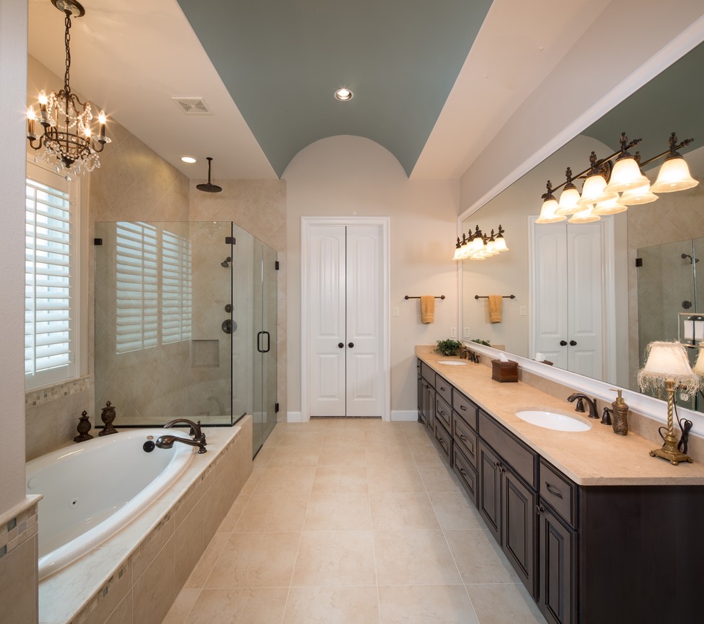 Photo of a medium sized classic ensuite bathroom in Houston with a submerged sink, freestanding cabinets, dark wood cabinets, a built-in bath, a corner shower, white tiles, porcelain tiles, beige walls and ceramic flooring.