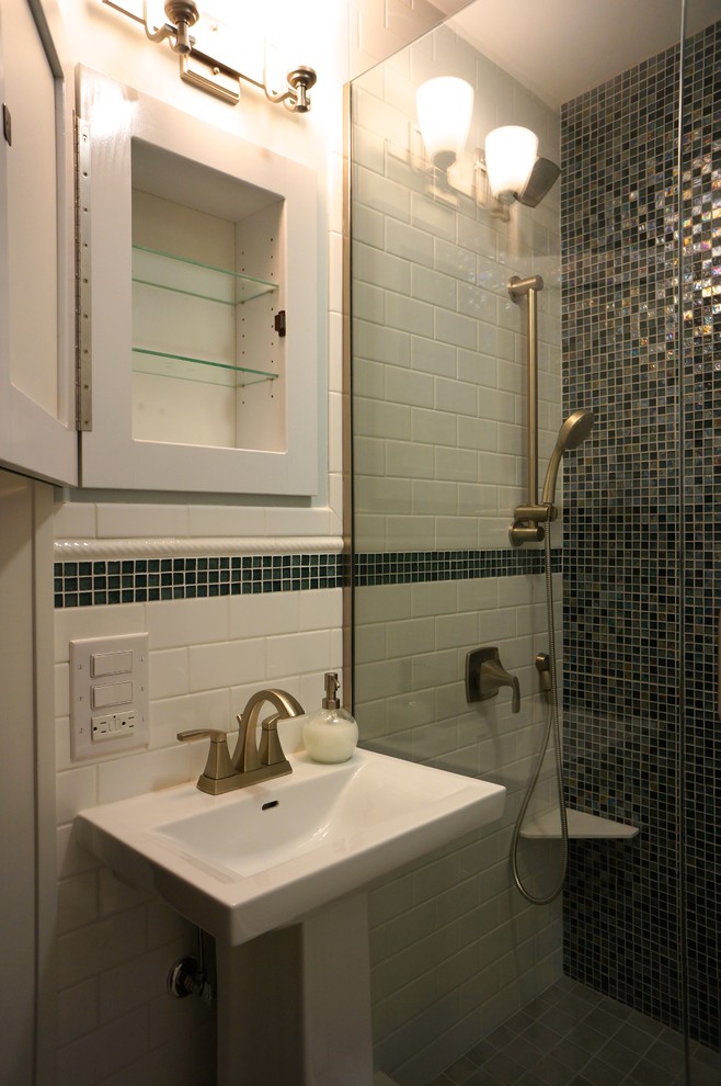 Photo of a medium sized eclectic family bathroom in Minneapolis with an alcove shower, a two-piece toilet, multi-coloured tiles, glass sheet walls, blue walls, porcelain flooring and a pedestal sink.