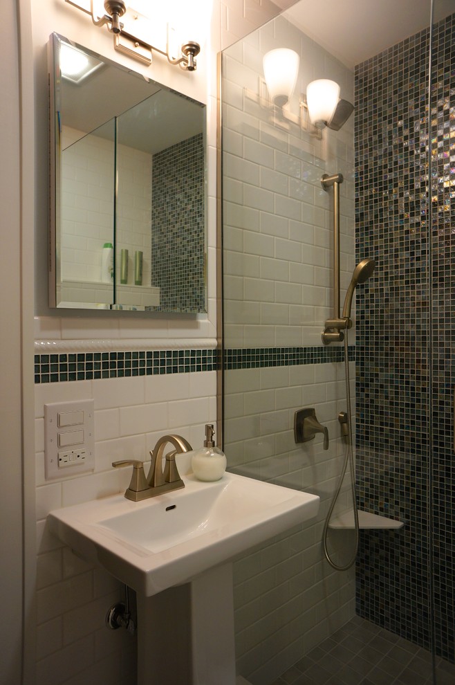 This is an example of a medium sized bohemian family bathroom in Minneapolis with an alcove shower, a two-piece toilet, multi-coloured tiles, glass sheet walls, blue walls, porcelain flooring and a pedestal sink.