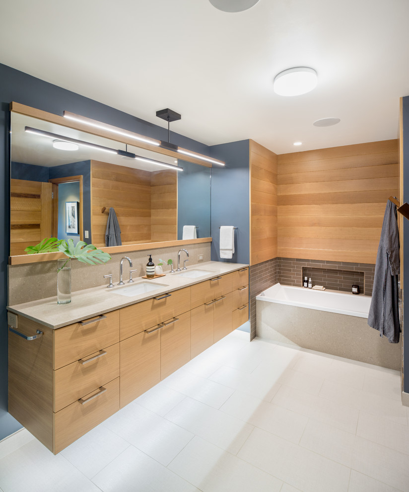 Example of a large trendy master brown tile and subway tile alcove bathtub design in Portland with flat-panel cabinets, light wood cabinets and quartz countertops