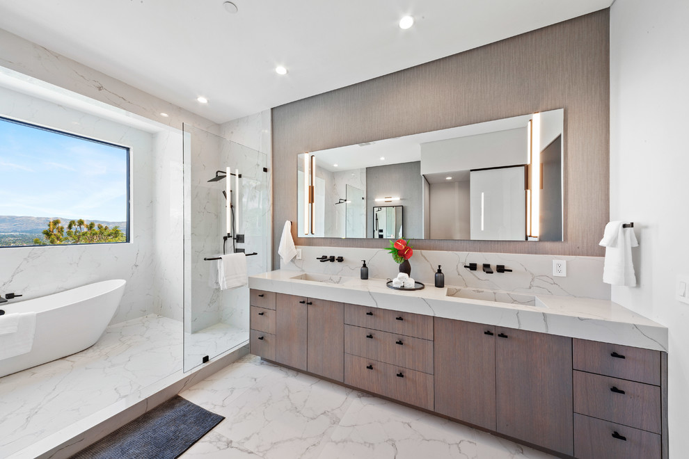 Design ideas for a large contemporary ensuite bathroom in Los Angeles with a freestanding bath, a shower/bath combination, a one-piece toilet, an integrated sink and an open shower.