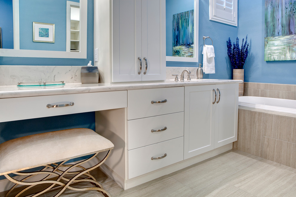 Inspiration for a mid-sized contemporary master porcelain tile drop-in bathtub remodel in Las Vegas with an undermount sink, shaker cabinets, white cabinets, marble countertops and blue walls