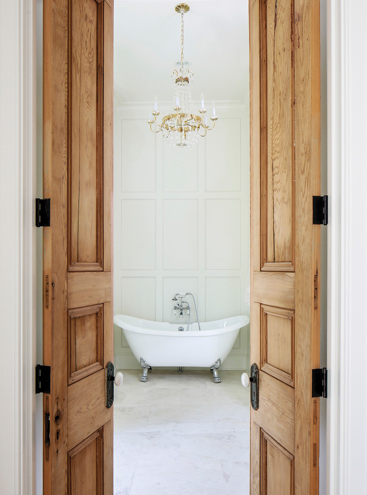 Elegant white tile claw-foot bathtub photo in Nashville