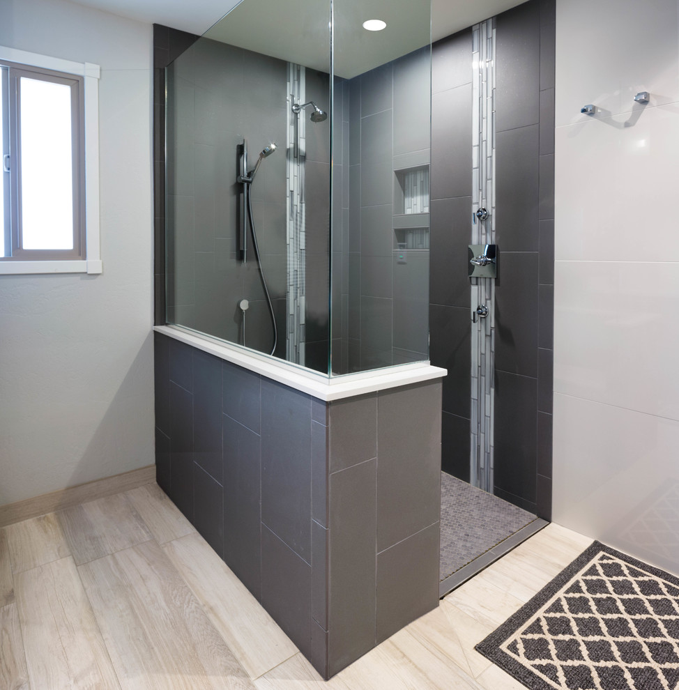 This is an example of a large modern ensuite bathroom in Phoenix with shaker cabinets, grey cabinets, a built-in shower, grey tiles, porcelain tiles, porcelain flooring, a submerged sink, engineered stone worktops, grey walls, beige floors and an open shower.