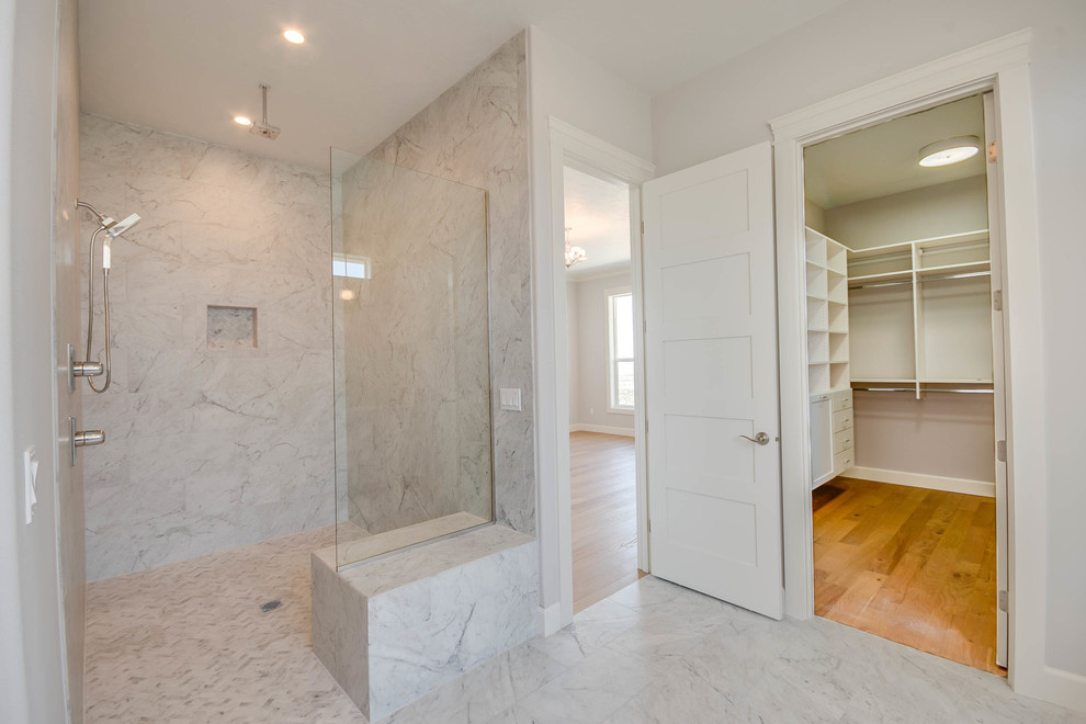 Inspiration for a large classic ensuite bathroom in Seattle with shaker cabinets, white cabinets, a freestanding bath, a built-in shower, a two-piece toilet, white tiles, marble tiles, beige walls, marble flooring, a submerged sink, marble worktops, white floors, an open shower and white worktops.