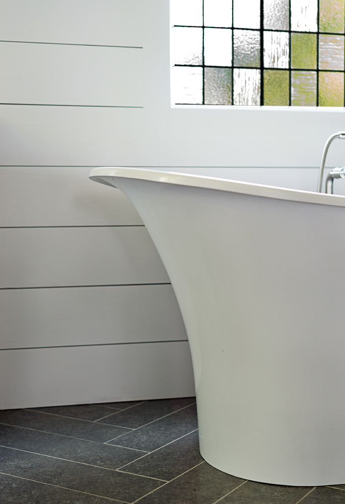 Example of a mid-sized transitional master porcelain tile porcelain tile and gray floor bathroom design in Other with blue walls, flat-panel cabinets, gray cabinets, an undermount sink, marble countertops and a hinged shower door