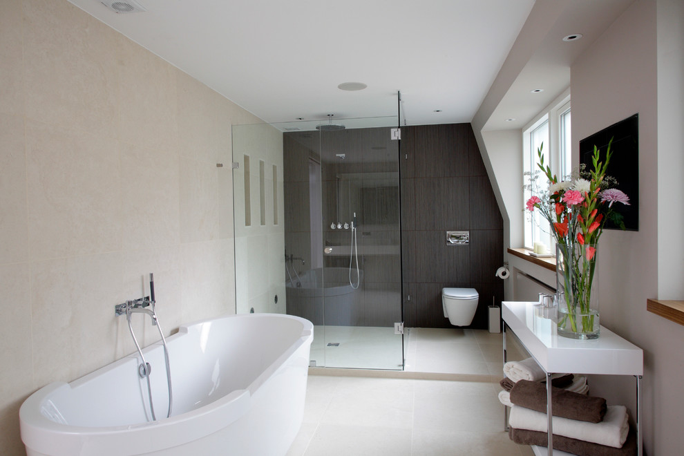 This is an example of a small contemporary ensuite bathroom in London with a wall-mounted sink, wooden worktops, a built-in shower, a wall mounted toilet, beige tiles, stone tiles and open cabinets.
