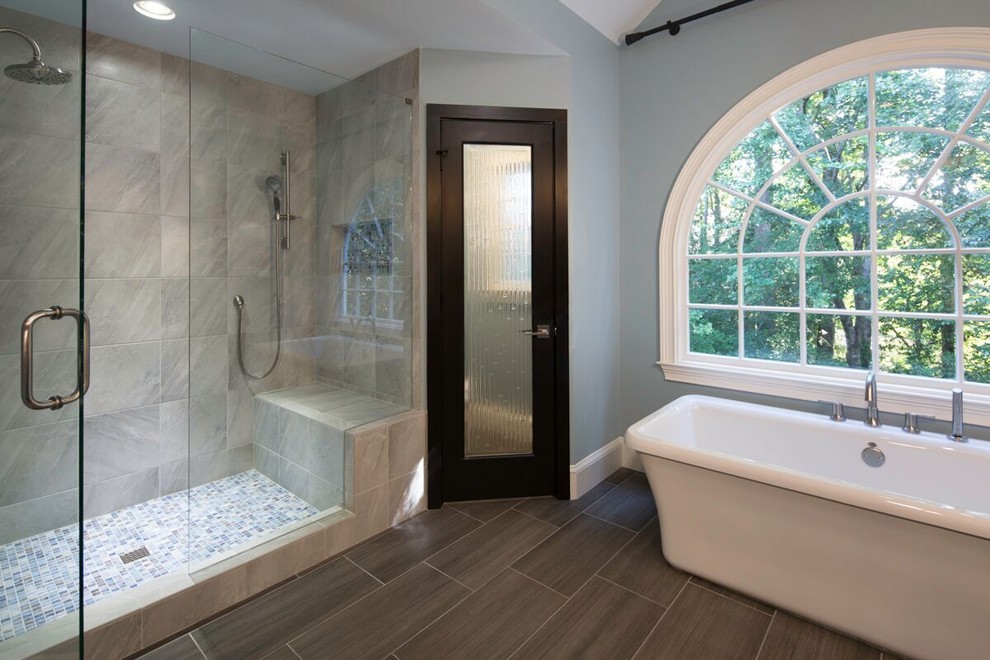 Inspiration for a large asian master gray tile and porcelain tile porcelain tile and gray floor bathroom remodel in Atlanta with open cabinets, light wood cabinets, blue walls, a vessel sink, quartz countertops and a hinged shower door