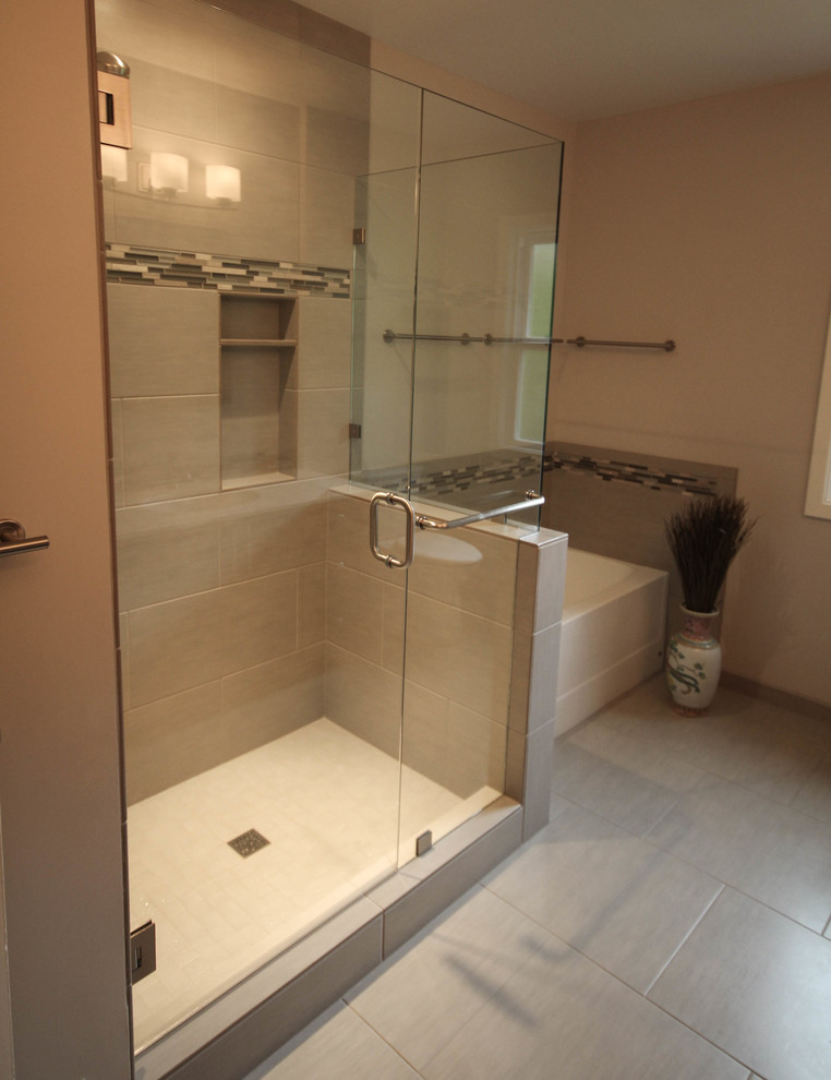 Photo of a large traditional family bathroom in Portland with flat-panel cabinets, medium wood cabinets, an alcove shower, a two-piece toilet, multi-coloured tiles, glass tiles, beige walls, porcelain flooring, a submerged sink and engineered stone worktops.