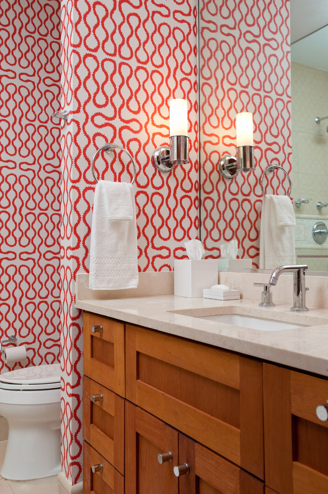 Photo of a world-inspired bathroom in New York with a submerged sink, shaker cabinets, medium wood cabinets and multi-coloured walls.