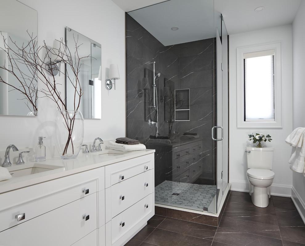 Example of a mid-sized transitional black tile and porcelain tile porcelain tile and gray floor corner shower design in Toronto with furniture-like cabinets, white cabinets, a one-piece toilet, white walls, an undermount sink, quartzite countertops, a hinged shower door and white countertops