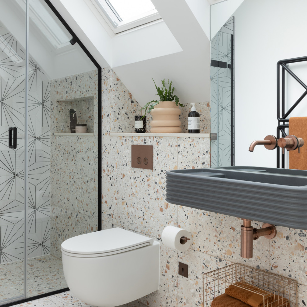 Inspiration for a mid-sized contemporary 3/4 single-sink alcove shower remodel in London with a wall-mount toilet, multicolored walls and a niche