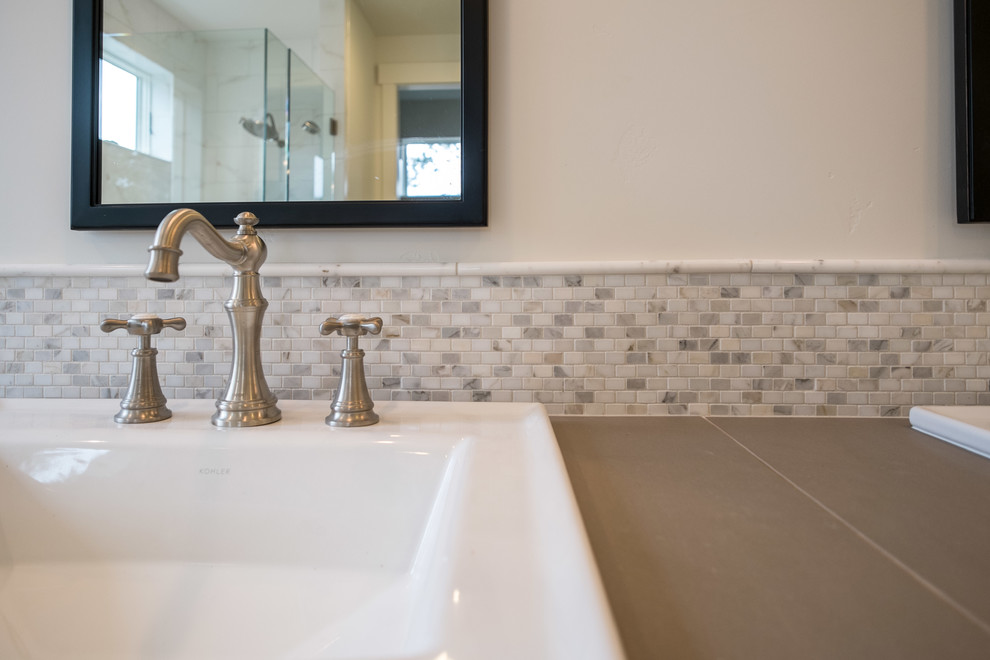Example of a mid-sized classic master porcelain tile porcelain tile bathroom design in Other with shaker cabinets, white cabinets, a drop-in sink and tile countertops