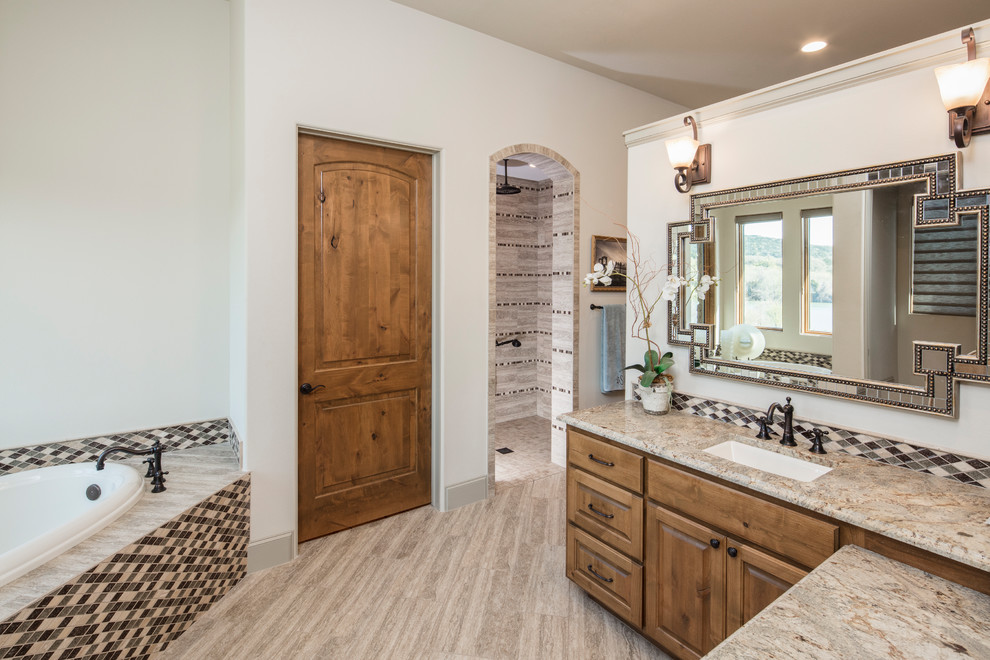 Large tuscan master multicolored tile and stone tile ceramic tile double shower photo in Austin with raised-panel cabinets, light wood cabinets, white walls, an undermount sink and granite countertops