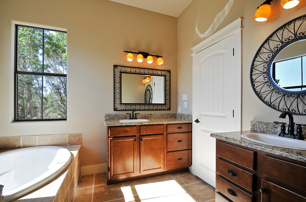 Inspiration for a mid-sized timeless 3/4 bathroom remodel in Austin with a drop-in sink, recessed-panel cabinets, medium tone wood cabinets, beige walls and granite countertops
