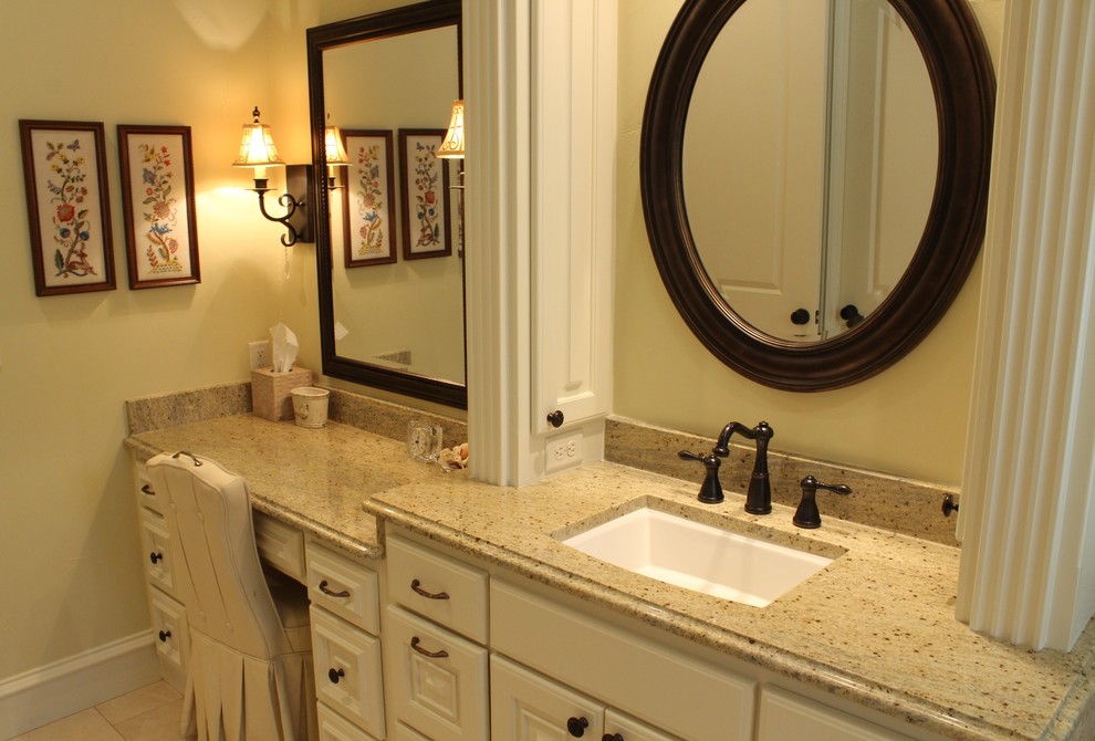 Example of a large classic master beige tile and stone tile ceramic tile bathroom design in Austin with raised-panel cabinets, white cabinets, granite countertops and yellow walls