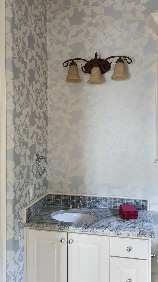 Tuscan blue tile and mosaic tile bathroom photo in Dallas with raised-panel cabinets, beige cabinets, an undermount sink and granite countertops