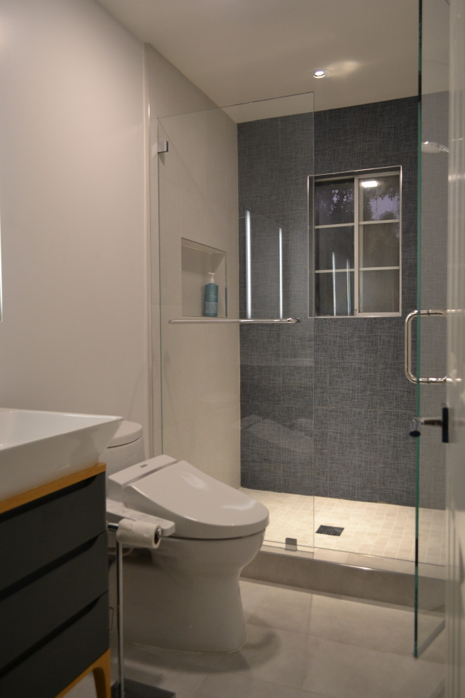 Design ideas for a medium sized modern shower room bathroom in San Francisco with flat-panel cabinets, blue cabinets, an alcove shower, a bidet, blue tiles, porcelain tiles, ceramic flooring, a vessel sink, white floors, a hinged door, white worktops, a single sink and a freestanding vanity unit.