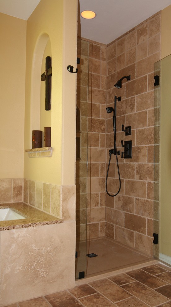 Medium sized modern ensuite bathroom in Austin with a built-in shower, brown tiles and stone tiles.