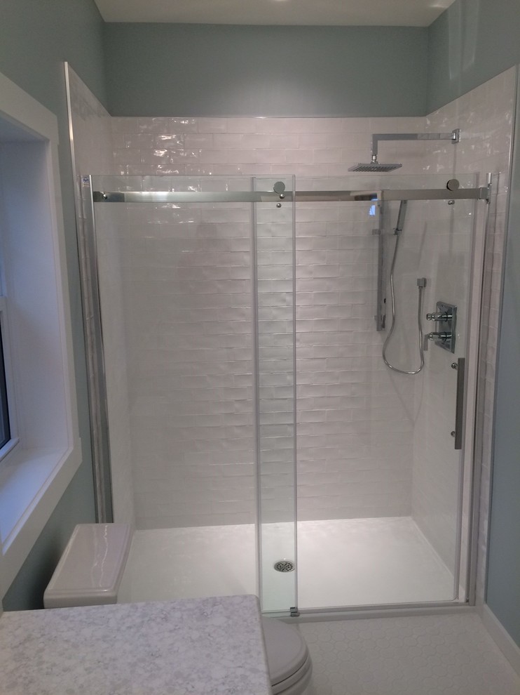 Inspiration for a medium sized classic ensuite bathroom in Toronto with a submerged sink, shaker cabinets, white cabinets, a walk-in shower, a two-piece toilet, white tiles, ceramic tiles, blue walls and ceramic flooring.