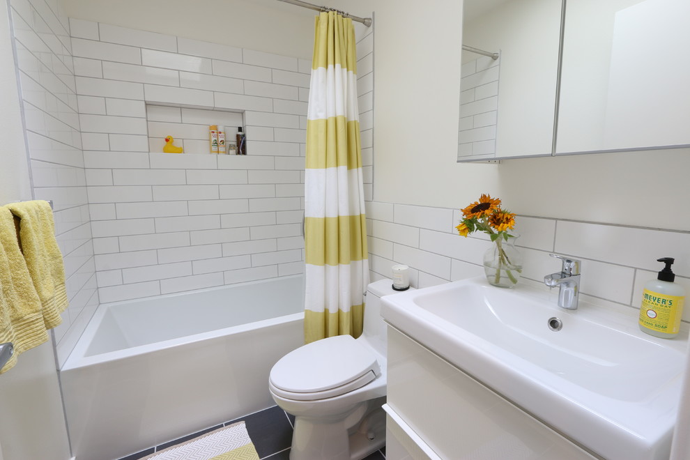 Mid-century modern white tile and subway tile bathroom photo in Denver with a console sink, flat-panel cabinets, white cabinets and beige walls