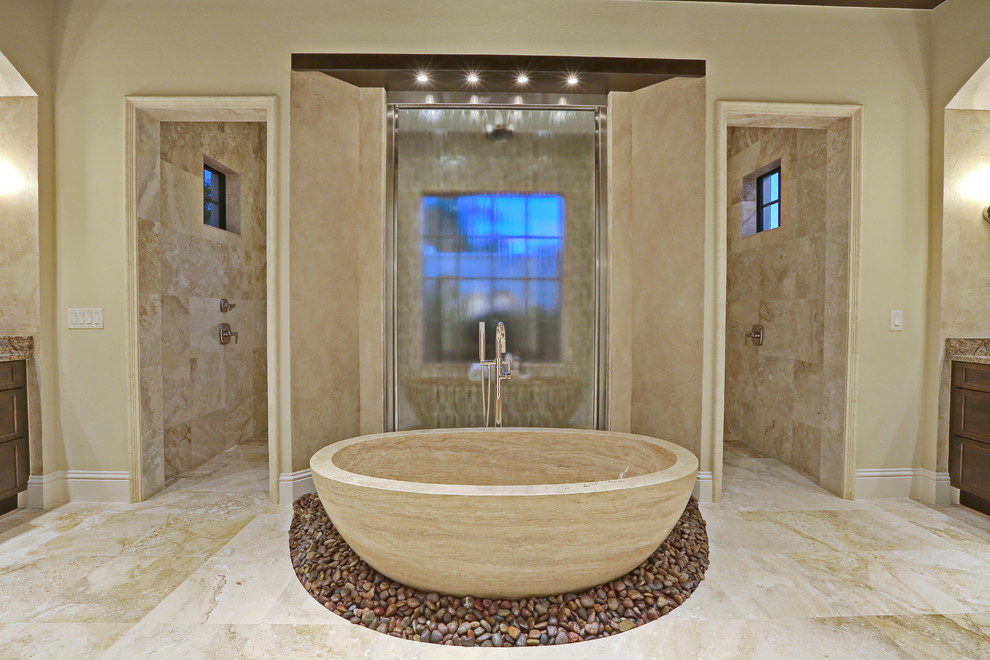 Huge trendy master beige tile and stone tile travertine floor bathroom photo in Tampa with an undermount sink, raised-panel cabinets, dark wood cabinets, granite countertops and beige walls